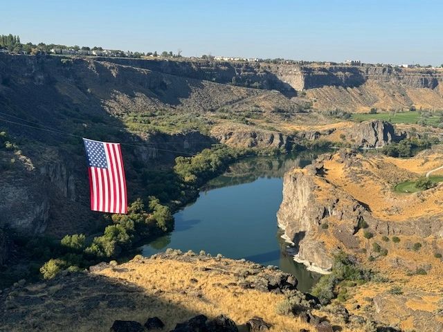American flag on canyon cliff